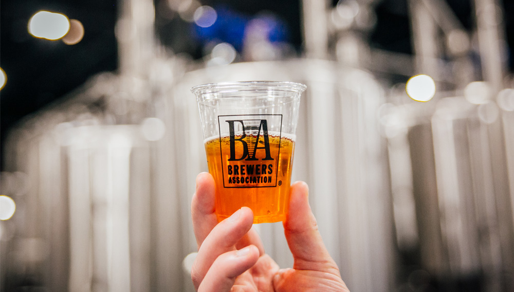 Plastic cup with beer with the imprint Brewers Association