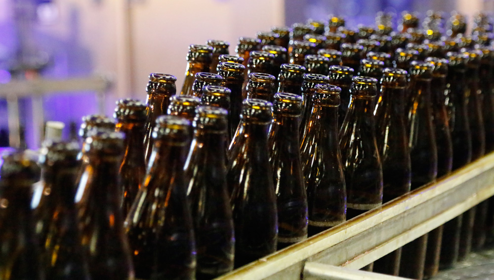 Empty beer bottles on a conveyor belt