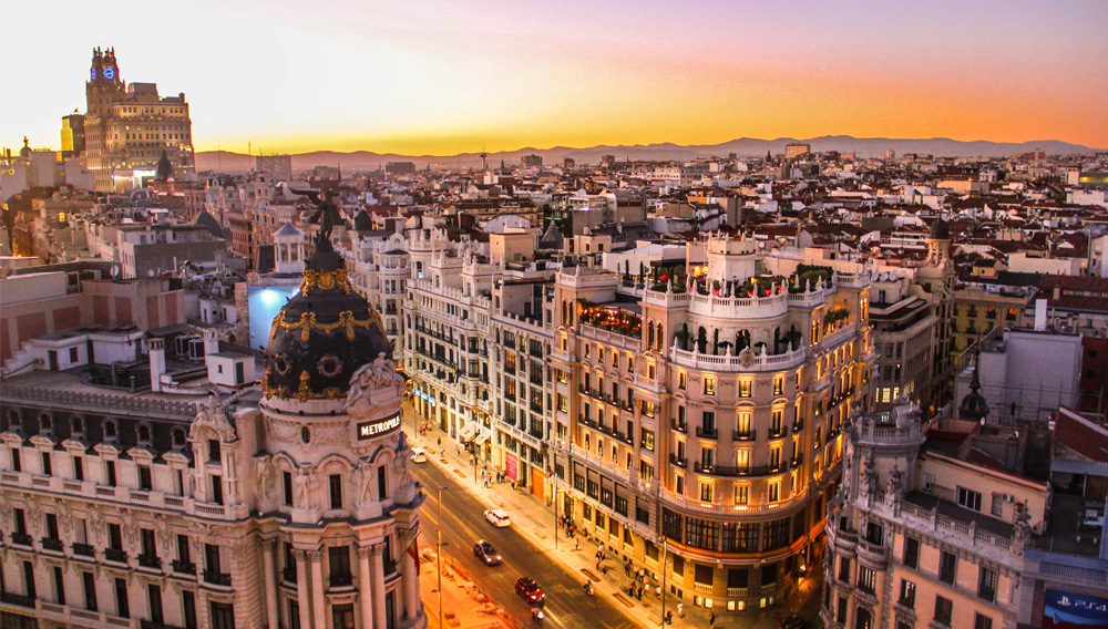 City panorama: Sunset view of Gran Via in Madrid (Photo by Florian Wehde on Unsplash)