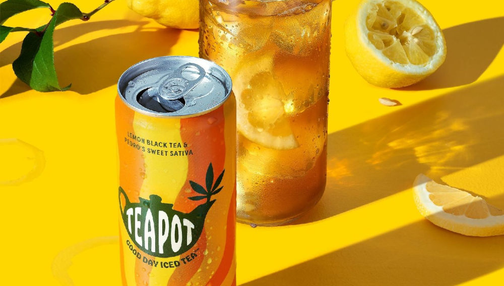 Yellow “Teapot” can and glass containing yellow liquid and lemon slices on a yellow surface (Photo: Courtesy of Boston Beer)