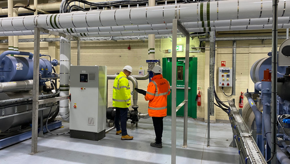 Two people in a refrigeration plant room at Britvic with three Gea BluAstrum chillers (Image: Gea)
