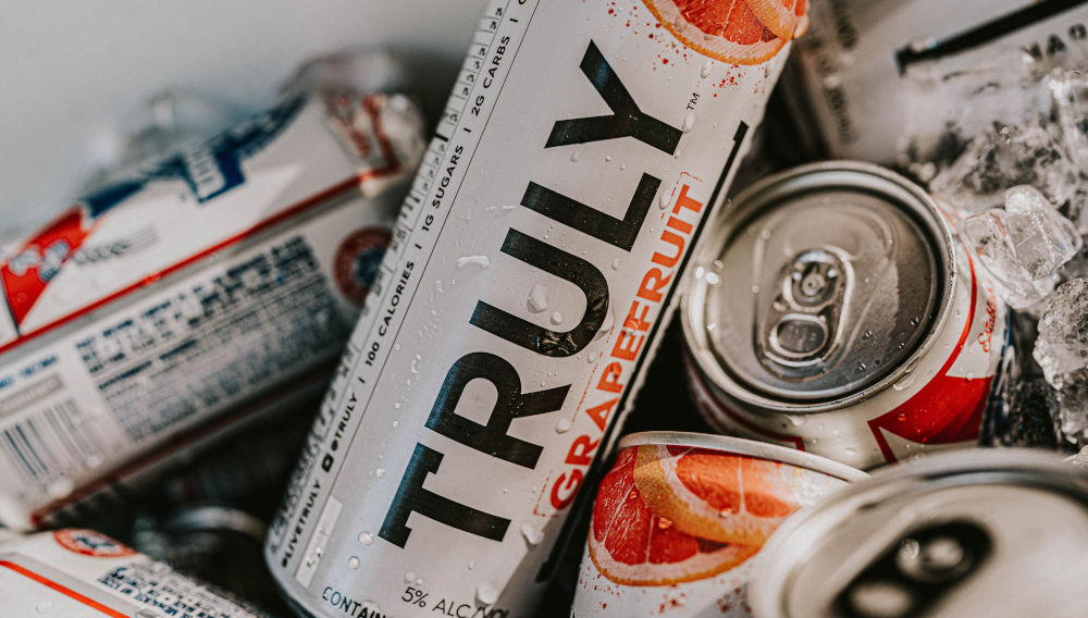 Cans with Truly Label (Photo: Camden & Hailey George on Unsplash)