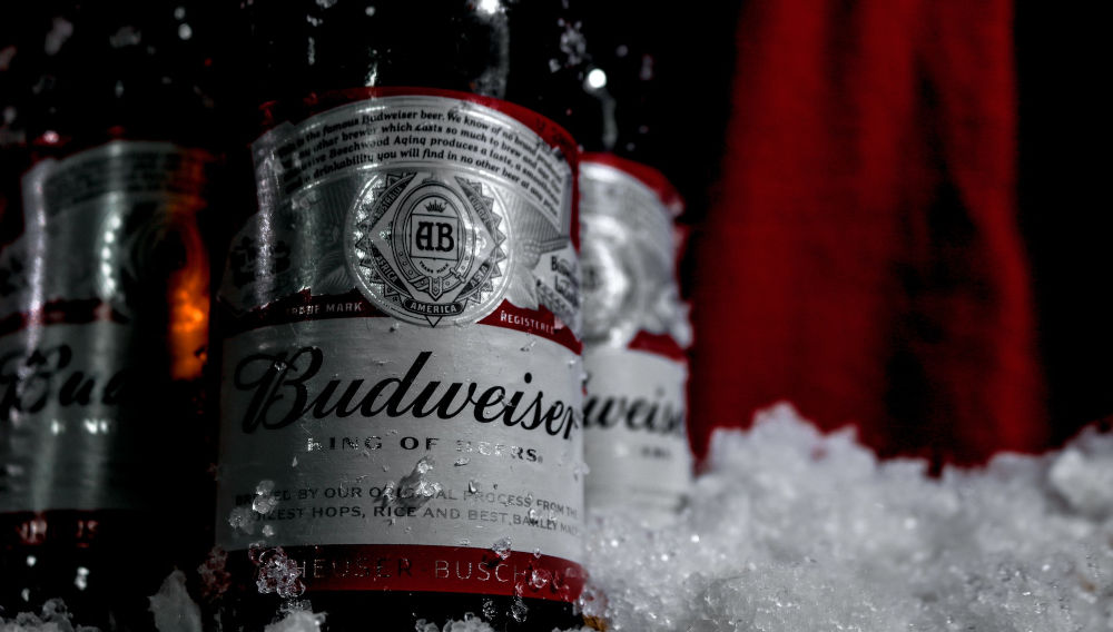 Budweiser Bottle on ice (Photo: Giuliana Catachura on Unsplash)