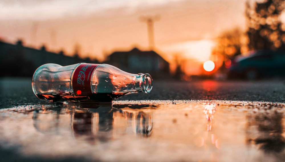 empty Coca-Cola bottle (Photo: Krisztian Matyas on Unsplash)