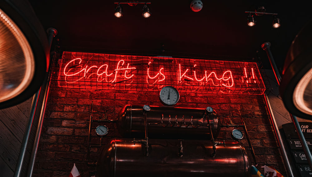 Red neon sign saying, “Craft is King!!” (Photo by Samuel Regan-Asante on Unsplash)