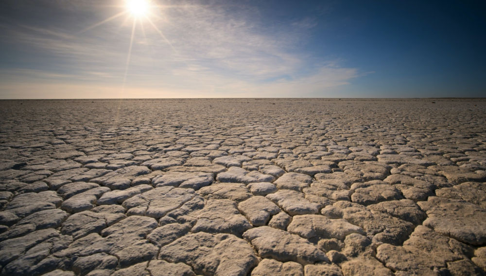 Dry soil under a sunny sky (Photo by Oleksandr Sushko on Unsplash)