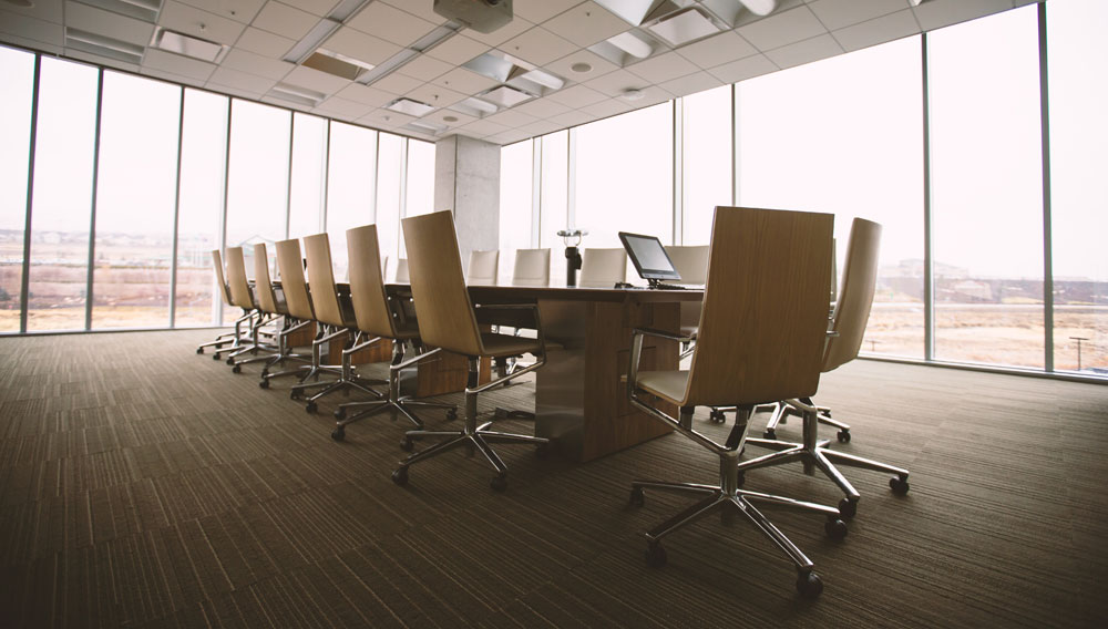 Table and chairs in an empty conference room (Picture: Benjamin Child on Unsplash)