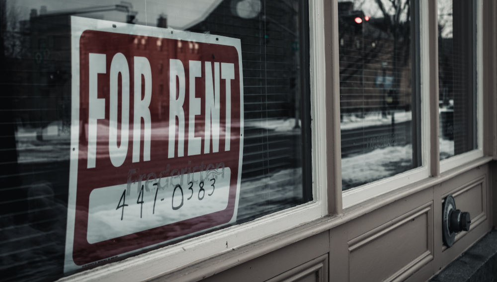 For rent sign in window (Photo by Aaron Sousa on Unsplash)