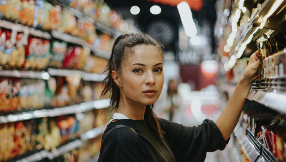 woman in a grocery store (Photo: Joshua Rawson Harris, Unsplash)