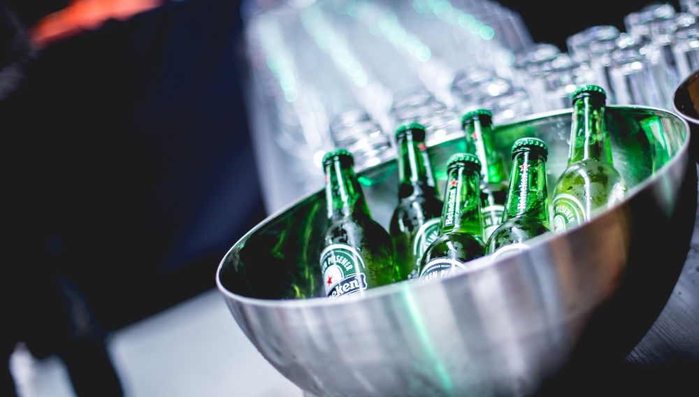 Green Heineken bottles (Photo: Christian-Gertenbach on Unsplash)