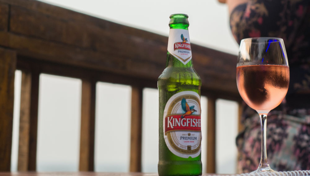 Kingfisher bottle and wine glass (Photo by Suvir Singh on Unsplash)