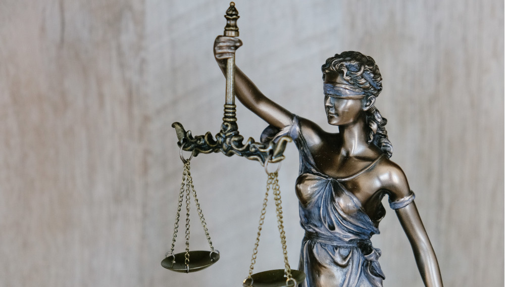 Lady Justice (photo: Tingey Injury Law Firm on unsplash)