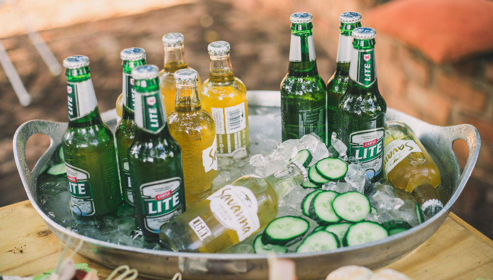 Lite beer bottles on tray (Photo by Jeanie de Klerk on Unsplash)