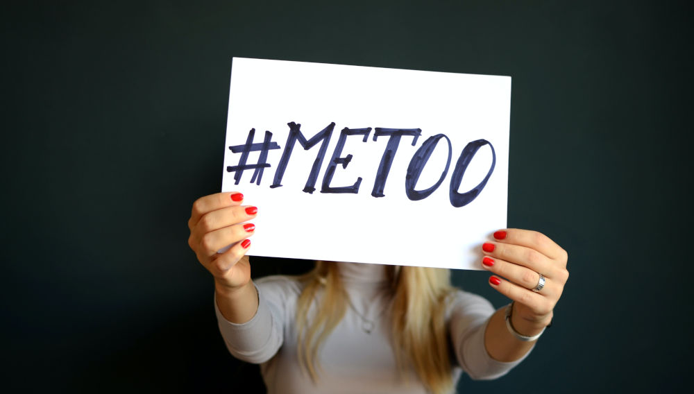 Woman with sign #metoo (Photo by Mihai Surdu on Unsplash)