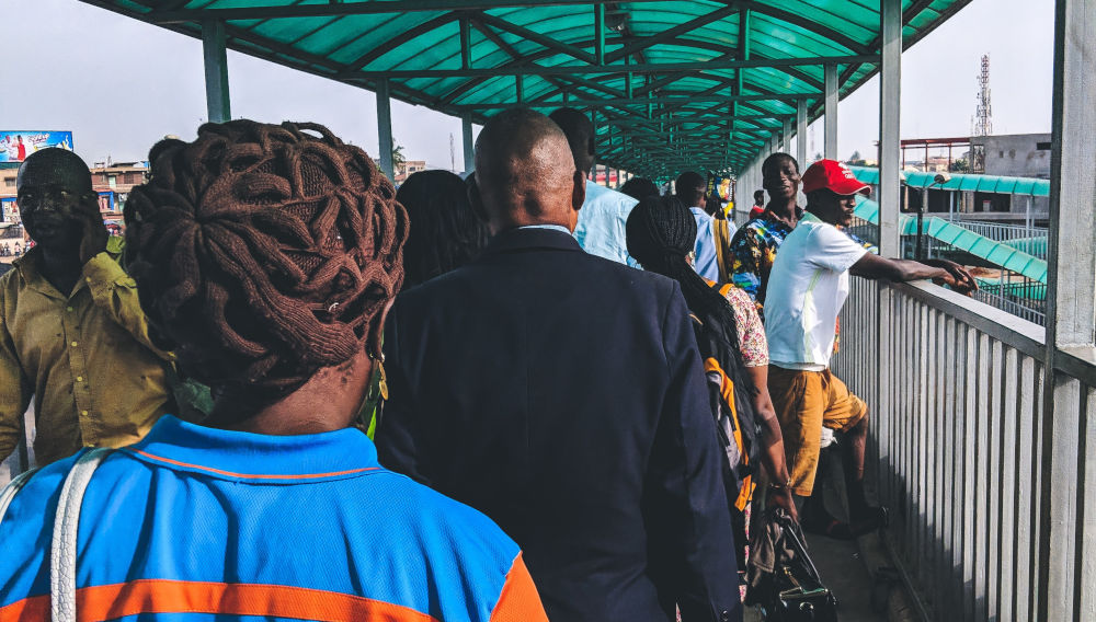 People walking (Photo: Joshua Oluwagbemiga, Unsplash)