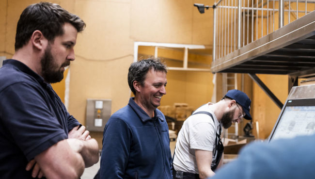 Christian Artzner, centre, on the day of the first brew in March. (Courtesy of Brasserie Perle)