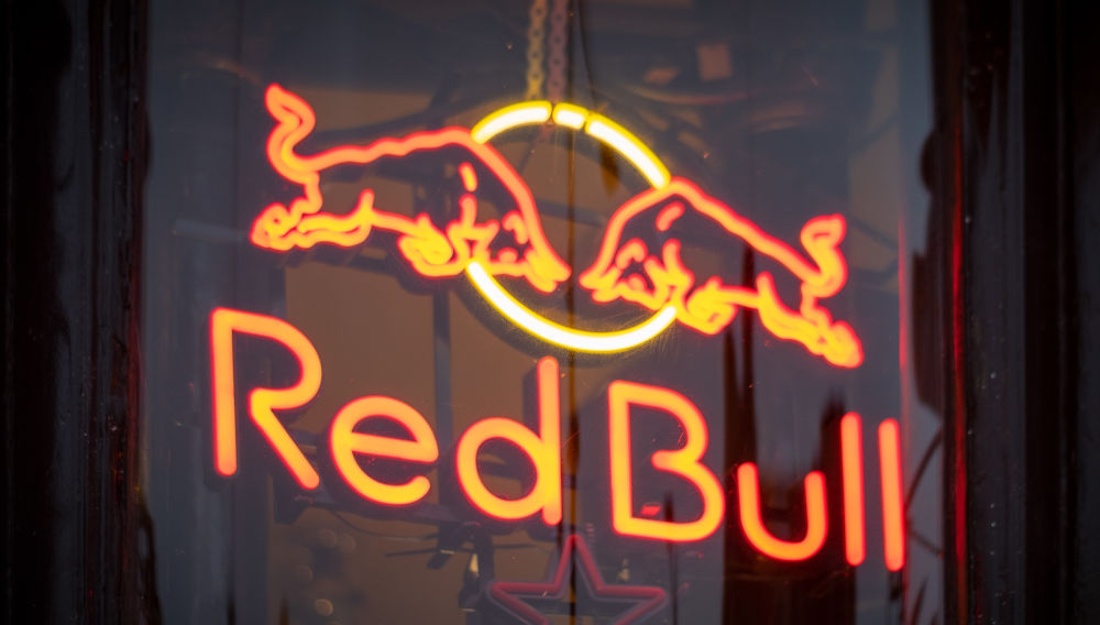 Red Bull sign (photo by Viktor Forgacs on Unsplash)