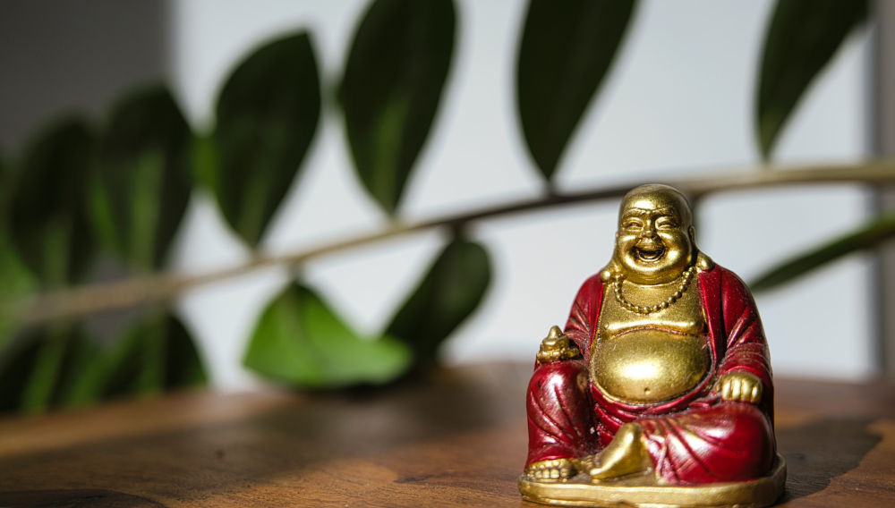 Smiling Buddha (Photo: Patrick Seguin on Unsplash)