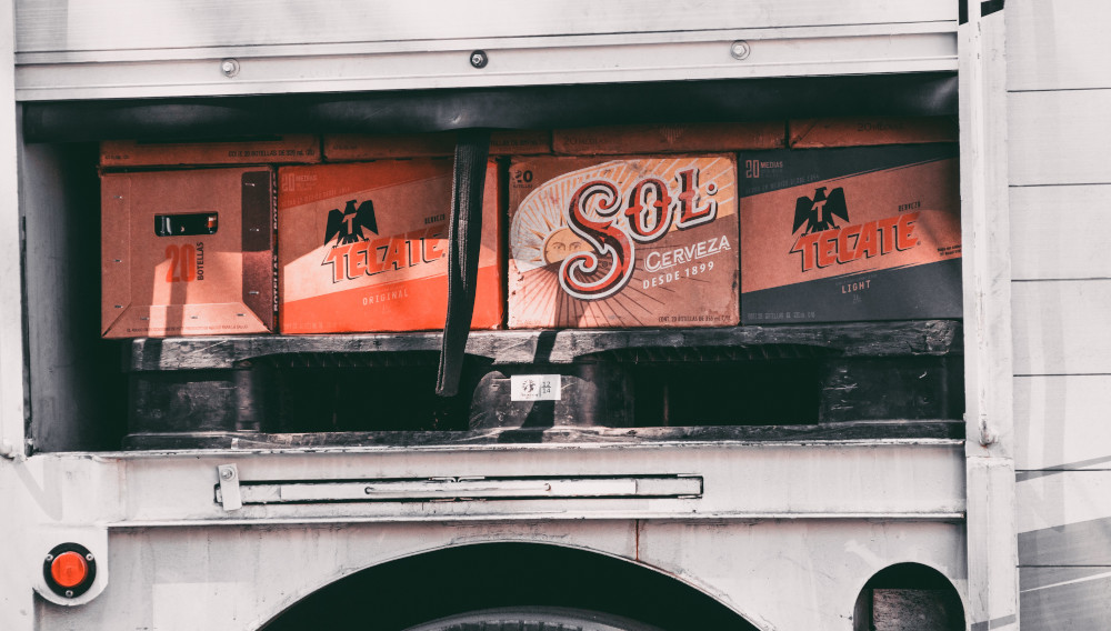 Sol cerveza boxes on a truck (Photo: Dennis Schrader on Unsplash)