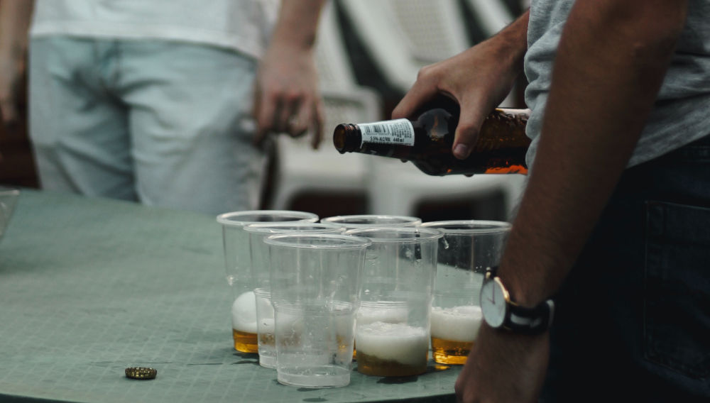 Nearly empty beer mugs on a table (Photo: Quinton Coetzee on Unsplash)