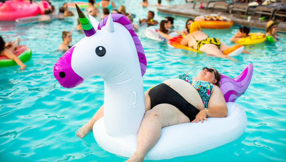 Woman on a pool unicorn (Photo: allgo on Unsplash)