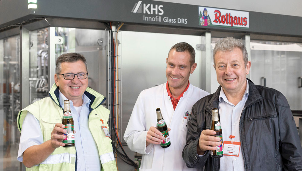 Zufriedene Partner: Mike Herrmann, Daniel Schnitzer und Ludwig Clüsserath (Bild: KHS Gruppe)