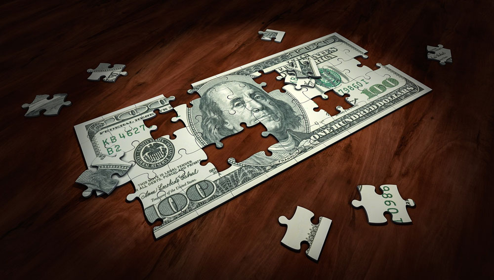 100-Dollar-Geldnote als Puzzle, bei dem einige Puzzle-Steine noch nicht an der richtigen Stelle liegen (Foto: Arek Socha auf Pixabay)