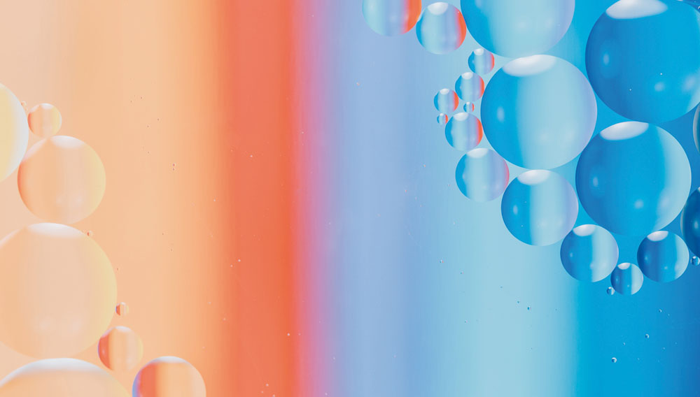 Farbverlauf rot zu blau mit stilisierten Blasen (Quelle: Pawel Czerwinski auf Unsplash)